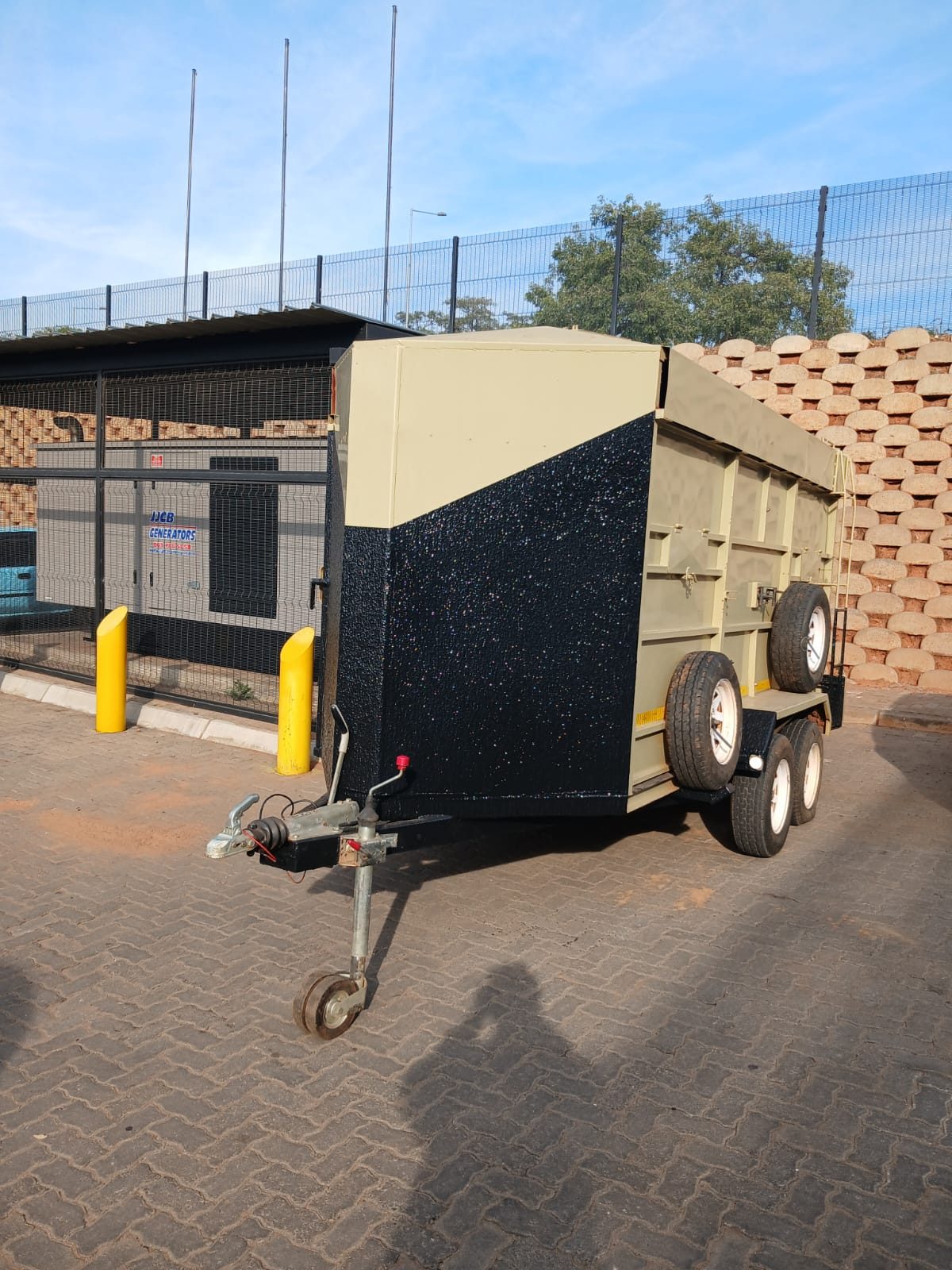 Box trailer, cream body with textured black lower panels