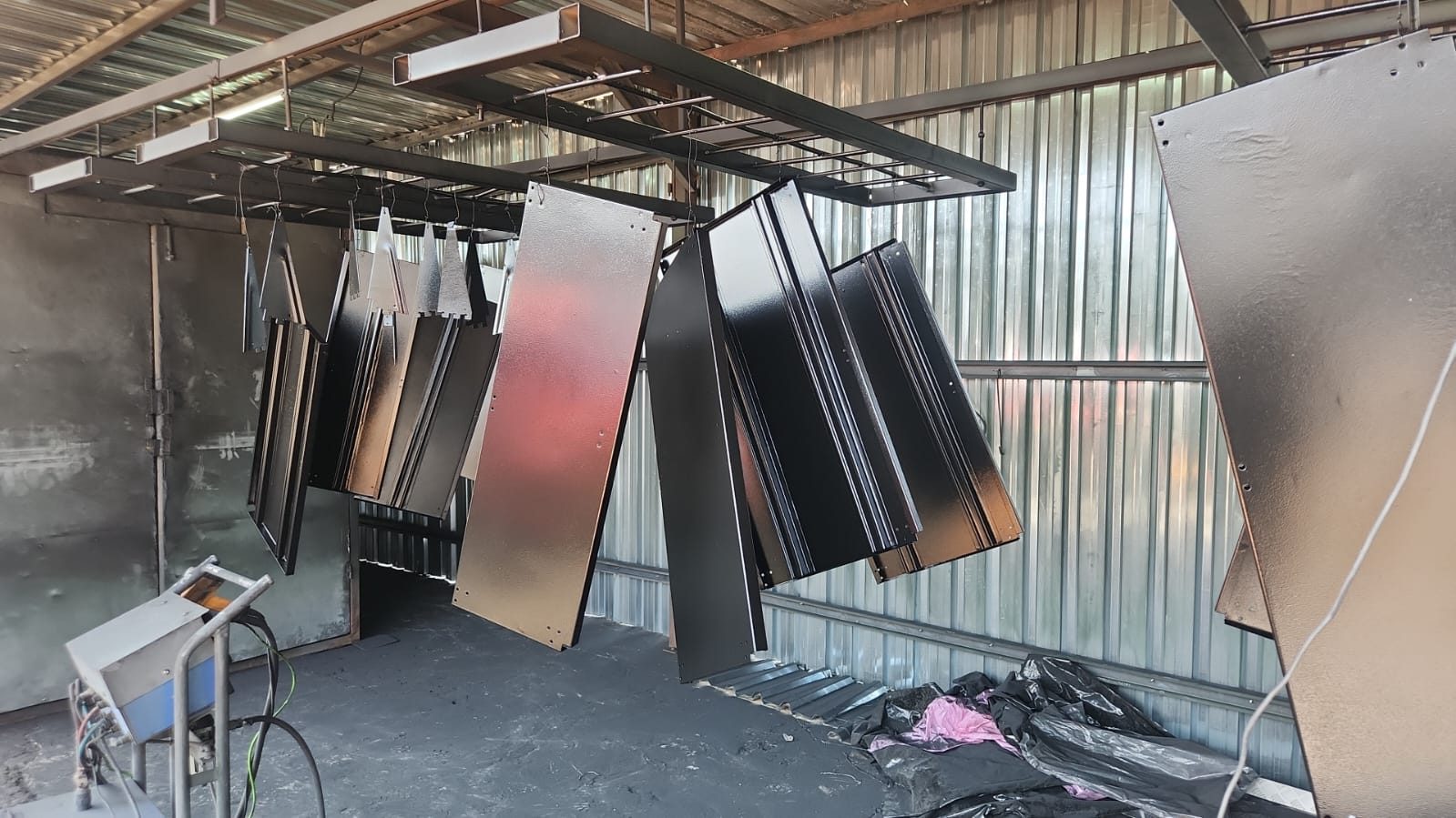 Powder coating oven and hanging line in the workshop